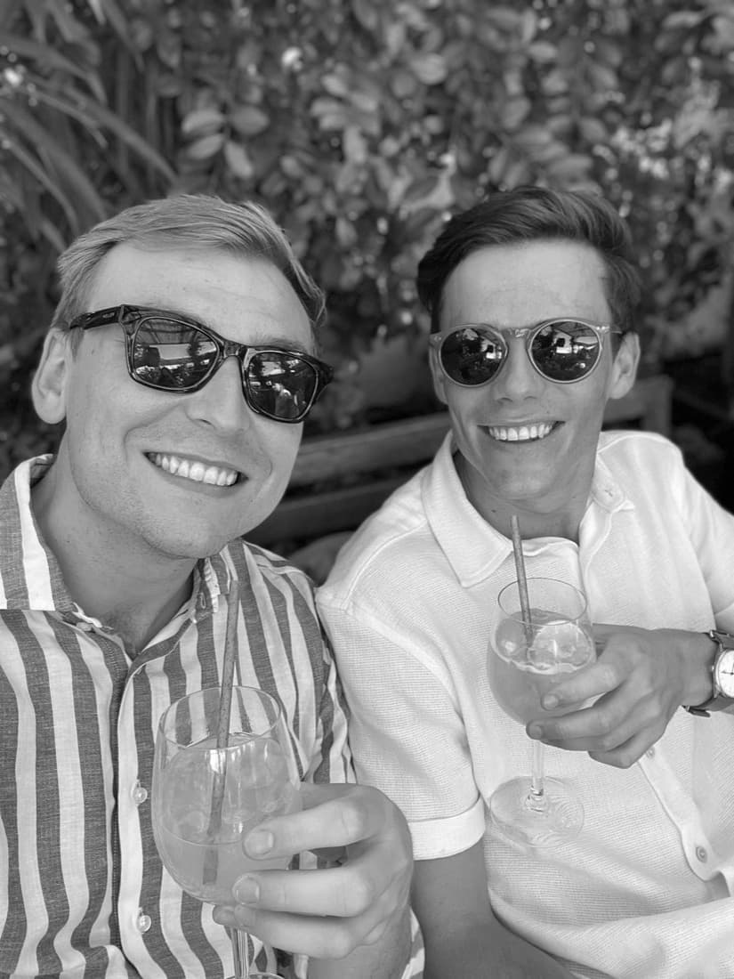 Gustaf and Magnus with drinks in the sunshine